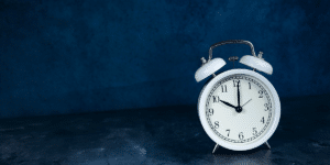 event image: alarm clock on dark blue background