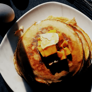 pancakes, egg and whisk